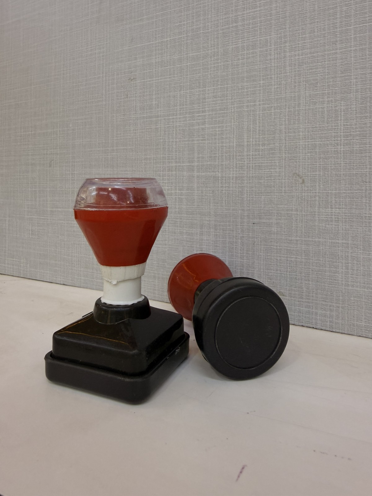 Plastic-bodied self-inking stamps with red ink, made by Swastika Handicraft in Kathmandu